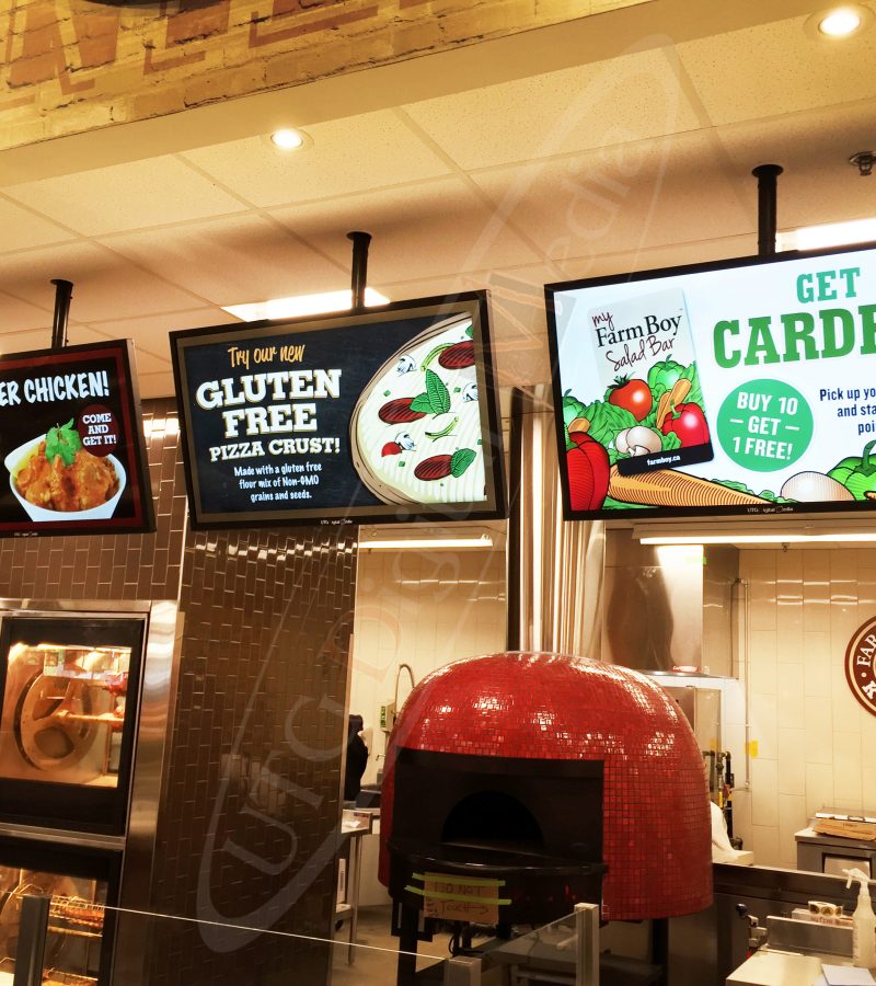 A UTG Wall Mounted LCD Screen at Farm Boy