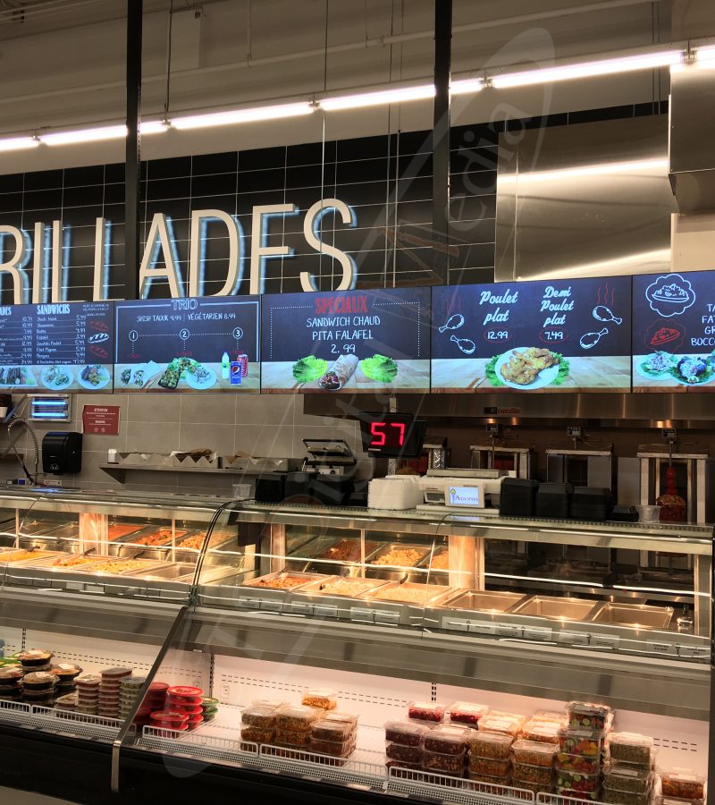 A UTG Wall Mounted LCD Screen at Marche Adonis