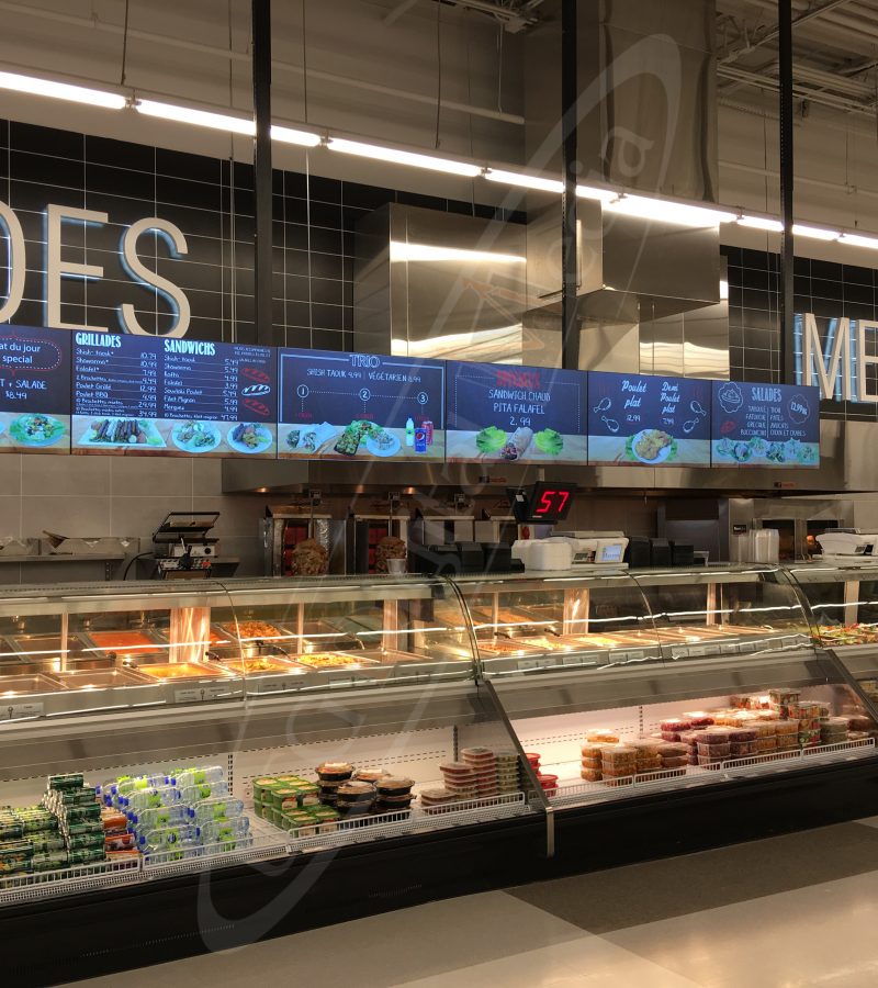 A UTG Wall Mounted LCD Screen at Marche Adonis