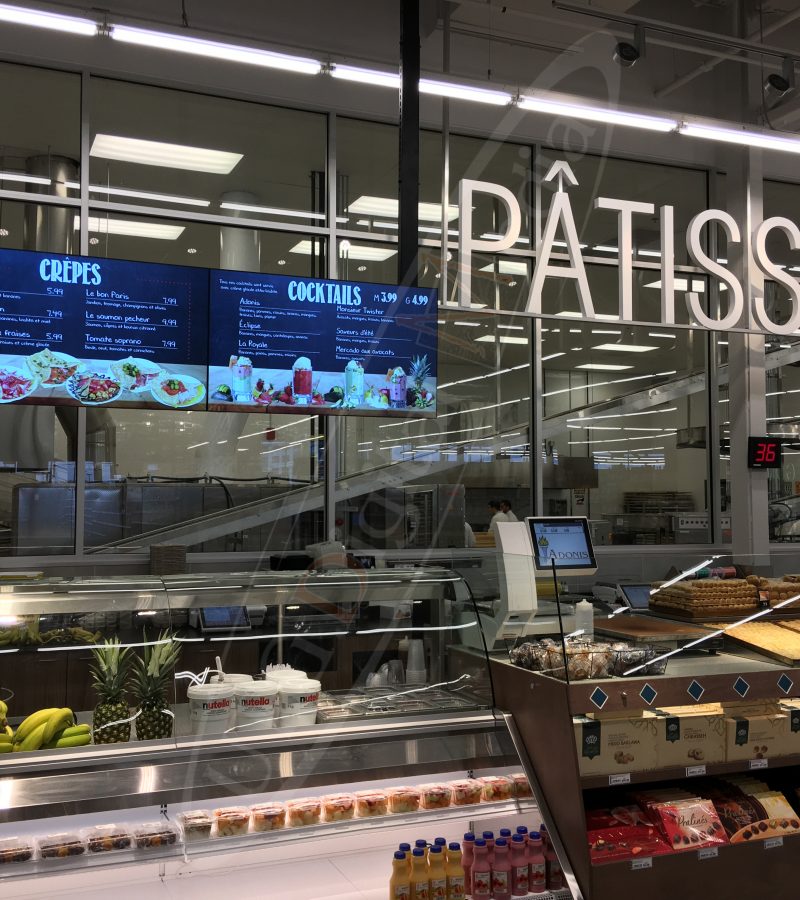 A UTG Wall Mounted LCD Screen at Marche Adonis